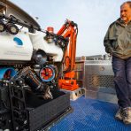 GFOE President and Founder Dave Lovalvo stands next to ROV Yogi on the deck of the R/V Annie. Credit: Daniel R. Rogers, GFOE